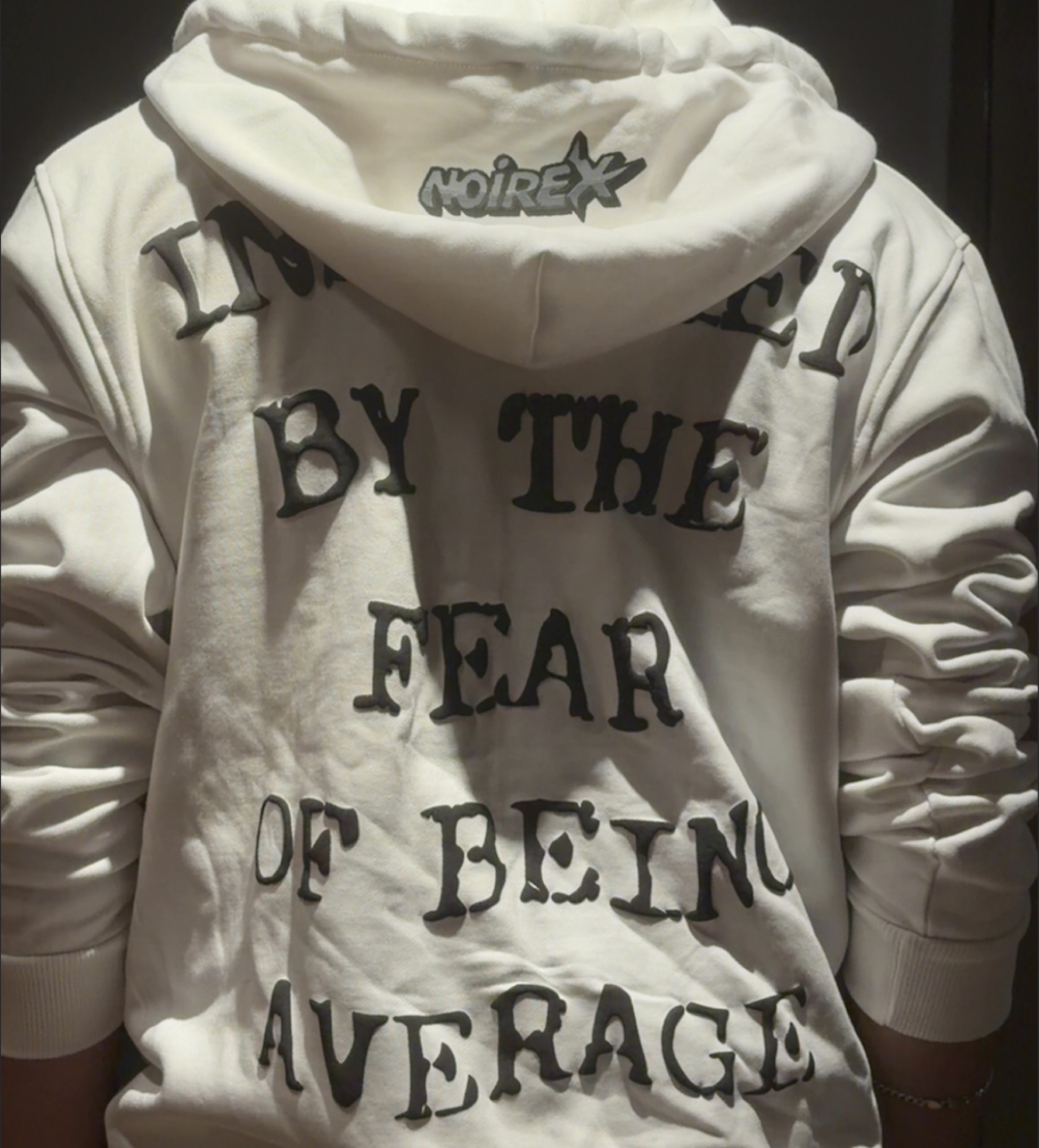 NOIREX hoodie worn outdoors